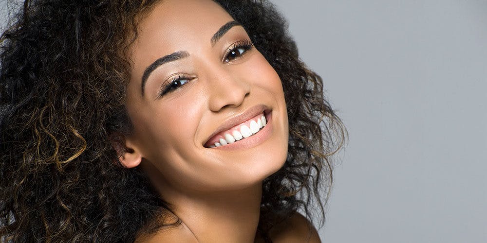 Smiling patient at a family dentist in London, ON